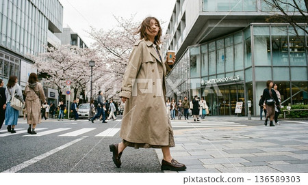 Blown by the spring breeze. Walking down Omotesando, surrounded by cherry blossoms, with a cup of coffee in hand, is a part of everyday life in the city. 136589303