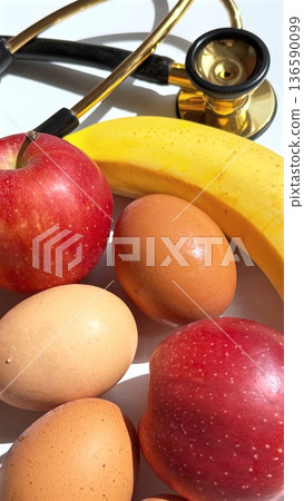 Health Check Essentials. Medical Equipment For Dietary Health Evaluation. Medical Devices Positioned With Food Items To Symbolize Health And Nutritional Monitoring Health Check Essentials. Medical Equipment For Dietary Health Evaluation. Medical Devices Positioned With Food Items To Symbolize Health And Nutritional Monitoring 136590099
