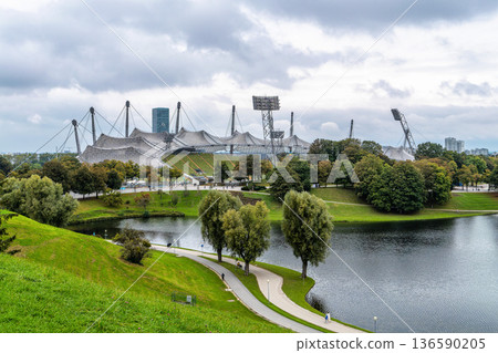 Munich, Germany - Oct 03, 2025: Stadium of the Olympiapark in Munich, Germany, constructed for the 1972 Summer Olympics Munich, Germany - Oct 03, 2025: Stadium of the Olympiapark in Munich, Germany, constructed for the 1972 Summer Olympics 136590205