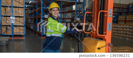 Warehouse worker working in warehouse storage.  136590231