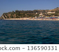 Beautiful panoramic view of the Calabrian coast during the summer season, featuring turquoise crystal-clear waters, dramatic rocky cliffs, and charming seaside scenery under bright blue skies. The 136590331