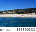 Beautiful panoramic view of the Calabrian coast during the summer season, featuring turquoise crystal-clear waters, dramatic rocky cliffs, and charming seaside scenery under bright blue skies. The 136590333