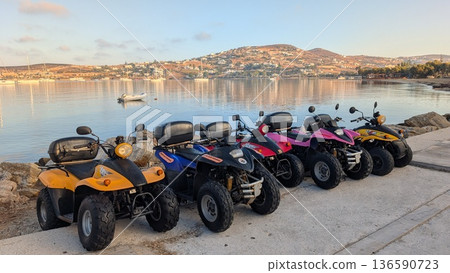 Colorful leisure buggies in front of Aegean sea 136590723