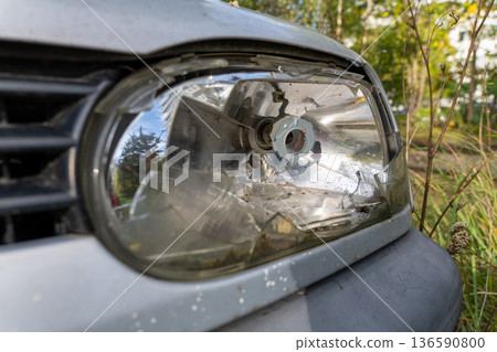 Broken Car Headlight Close Up Broken Car Headlight Close Up 136590800