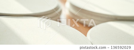 Close-up of smooth beige circular shapes in soft natural light abstract 136592029