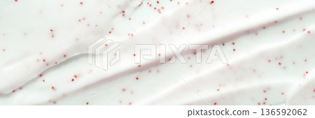 Close-up of white cream with red particles creating texture and patterns Close-up of white cream with red particles creating texture and patterns 136592062