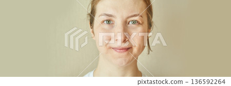 Smiling caucasian young adult female with light brown hair and green eyes Smiling caucasian young adult female with light brown hair and green eyes 136592264