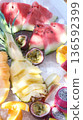 A tasty fruit salad on top of clear ice 136592399