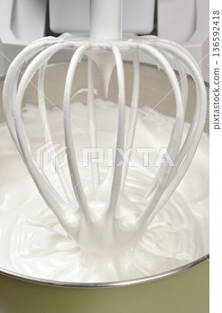 Meringue mixture in a kitchen mixer 136592418