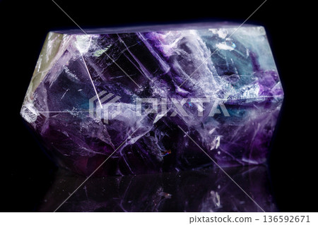 Macro mineral stone Fluorite crystal on a black background 136592671