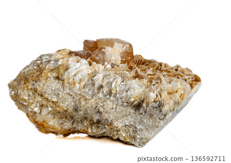 Macro mineral stone Scheelite on a white background Macro mineral stone Scheelite on a white background 136592711