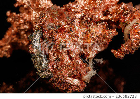 Macro mineral stone Copper on black background 136592728