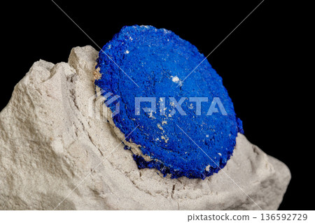 Macro mineral stone Azurite in siltstone against black background 136592729