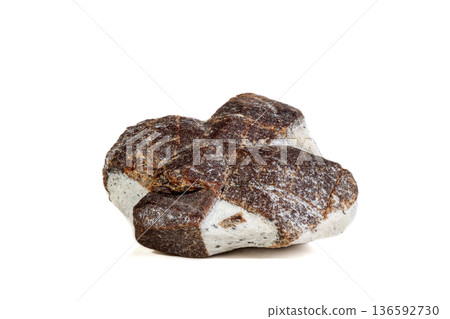Macro mineral stone Staurolite on a white background 136592730