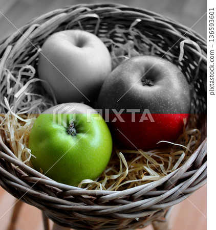 Handmade Basket Filled with Wood Shavings and Whole Apples Variety Types on It Split in Color Stock Image. Healthy and Unhealthy Fruits Concept Photo 136593601