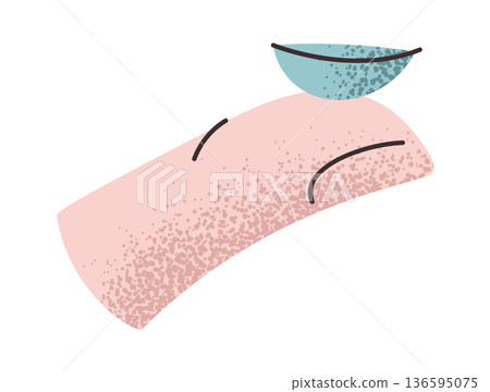 Contact lens on human finger 136595075