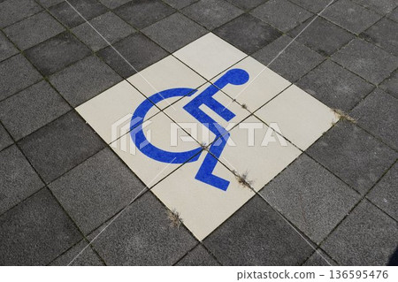 Wheelchair mark caring parking lot 136595476