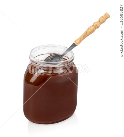 Chocolate Hazelnut Spread in Glass Jar with Spoon Isolated on White Chocolate Hazelnut Spread in Glass Jar with Spoon Isolated on White 136596827