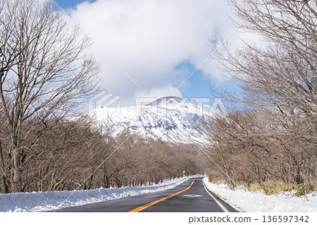 Snow-covered Mount Nasu seen from the road 136597342
