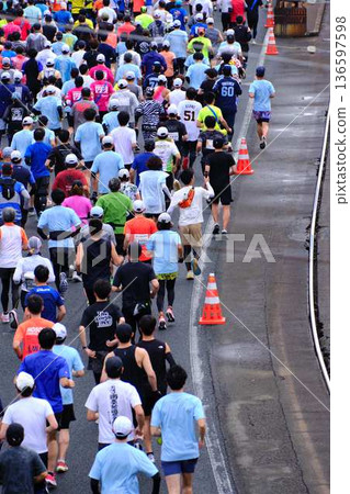City marathon marathon runner running downhill 136597598
