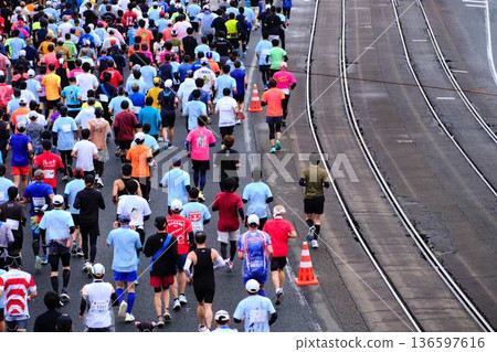 City marathon marathon runner running downhill City marathon marathon runner running downhill 136597616