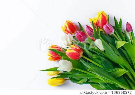 Bouquet of colorful multicolored tulips on white background. Happy easter. Spring symbol Bouquet of colorful multicolored tulips on white background. Happy easter. Spring symbol 136598572