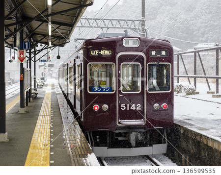 Nose Electric Railway's 5100 series train stops at a station in the snow Nose Electric Railway's 5100 series train stops at a station in the snow 136599535