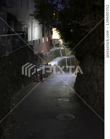A night view of a hilly road 136600352