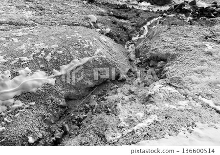 "Hakukuro" hot springs flowing through the rugged mountainside of "Noboribetsu Jigokudani" in winter 136600514