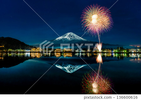 Winter fireworks at Lake Kawaguchi: Mt. Fuji reflected on the lake surface and fireworks Winter fireworks at Lake Kawaguchi: Mt. Fuji reflected on the lake surface and fireworks 136600616