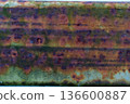 Close-up of weathered rusty metal with textured surface and patterns 136600887