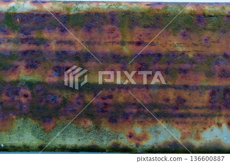 Close-up of weathered rusty metal with textured surface and patterns 136600887