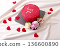Red love cake with roses on white fabric background for romantic occasion 136600890
