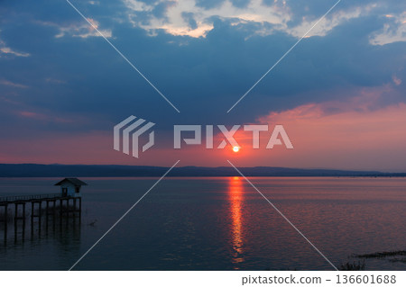 Dramatic sunset over a lake at Lam Chae Dam, Nakhon Ratchasima, Thailand 136601688