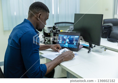 Black Researcher Making a Quantum Computing Experiment, Black Researcher Making a Quantum Computing Experiment, 136602182