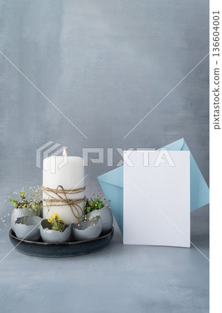 Envelope mockup template Self made egg shell with candle handmade decoration for Easter holiday. Copy space greeting card present gift ideas. Creative reuse zero waste sustainable living eco-friendly 136604001