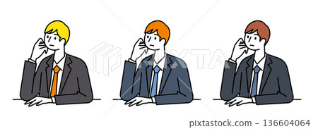 A man in a suit leaning on his chin and lost in thought A man in a suit leaning on his chin and lost in thought 136604064