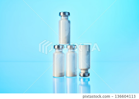 Vials stacked with white powder for medication research Vials stacked with white powder for medication research 136604113