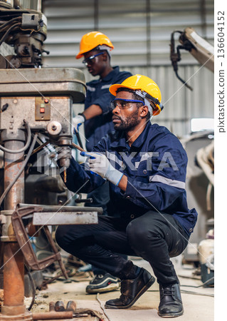 Workers Factory or Engineering work at factory site check up machine or products in site. 136604152