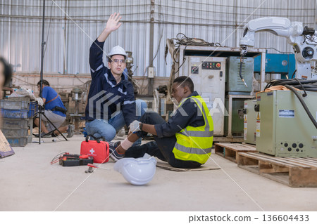 First aid support accident at work of worker at factory. First aid support accident at work of worker at factory. 136604433