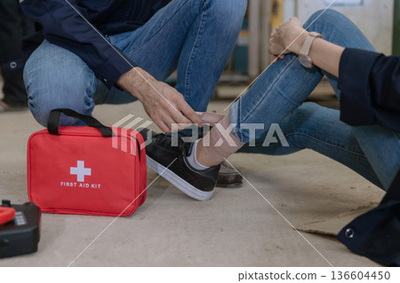First aid support accident at work of worker at factory.  136604450