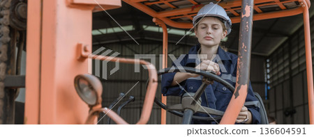 Woman worker at forklift driver happy working in industry factory logistic ship. Woman worker at forklift driver happy working in industry factory logistic ship. 136604591