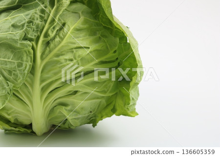 Whole spring cabbage in season on a white background Whole spring cabbage in season on a white background 136605359
