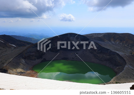 Snow still remains on the mountainside Snow still remains on the mountainside 136605551