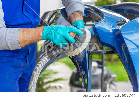 Bulgarian mechanic working in auto shop. Bulgarian mechanic working in auto shop. 136605744
