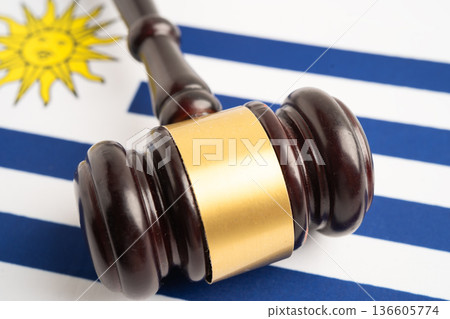 Uruguay flag with judge hammer, Law and justice court. Uruguay flag with judge hammer, Law and justice court. 136605774