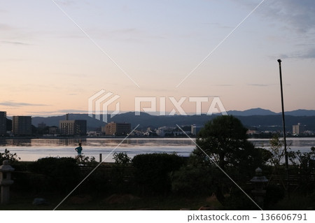 A quiet moment overlooking the waterfront and cityscape at dusk A quiet moment overlooking the waterfront and cityscape at dusk 136606791