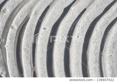 Abstract texture creating pattern of undulating waves with light and shadow Abstract texture creating pattern of undulating waves with light and shadow 136607022