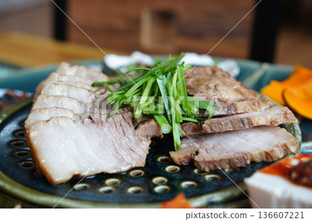 Traditional Korean Boiled Pork Belly Slices Bossam with Chives Garnish Traditional Korean Boiled Pork Belly Slices Bossam with Chives Garnish 136607221