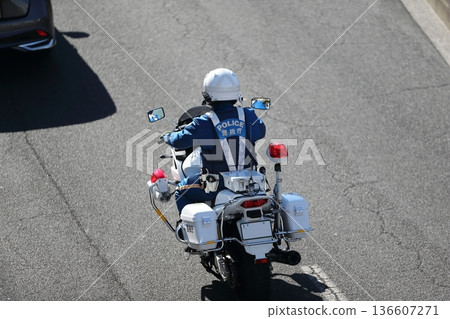 Image of a police motorcycle on patrol 136607271